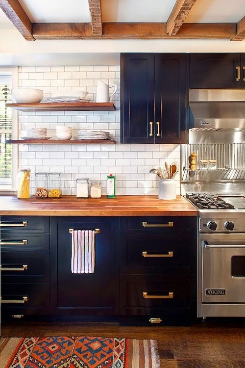 Navy Blue Cabinets with Wood Countertop and Brass Hardware
