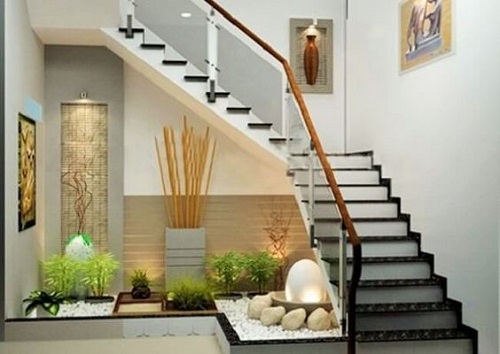 Decorative Objects and Greenery Under Staircase