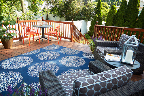 Backyard Deck Decorated with a Large Patterned Rug
