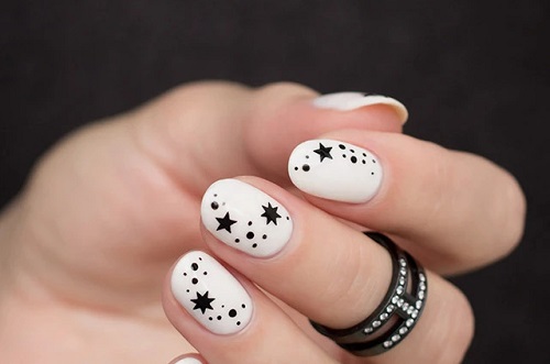 Minimalist White Nails With Black Stars