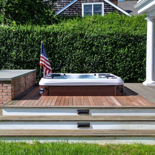 Hot Tub With Green Privacy Fence