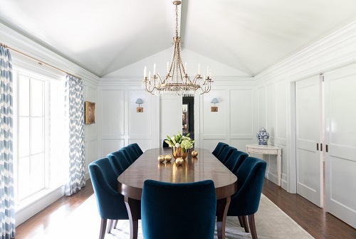 Peacock Blue Velvet Chairs, Oval Dining Table, and Brass Chandelier