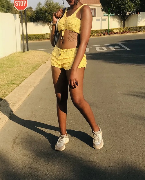 crochet top and ruffled shorts