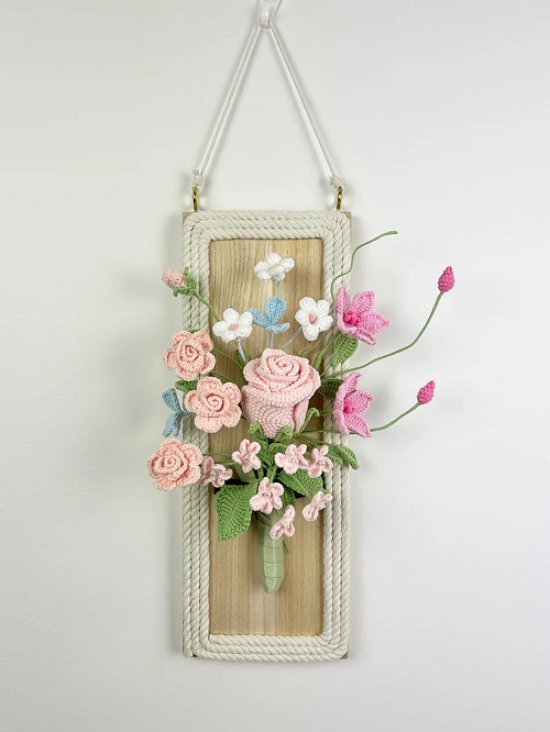 crochet flowers with wood wall hanging. Pink rose and clematis arrangement wall art