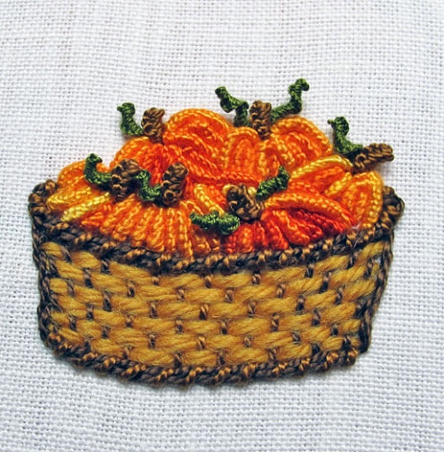 embroidered pumpkins in a basket